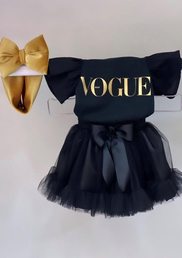 Black vogue bodysuit with black ruffled sleeves