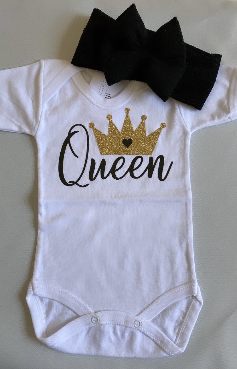 Queen's white bodysuit with golden glitter crown with black heart